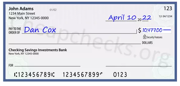 10477.00 dollars written on a check