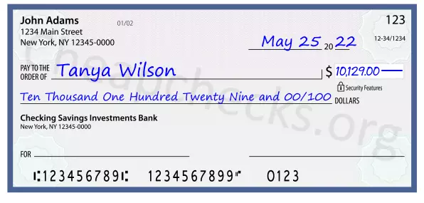 Ten Thousand One Hundred Twenty Nine and 00/100 filled out on a check