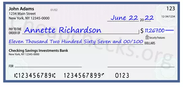 Eleven Thousand Two Hundred Sixty Seven and 00/100 filled out on a check