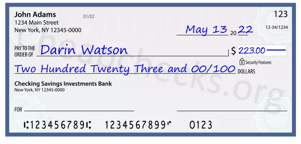 Two Hundred Twenty Three and 00/100 filled out on a check