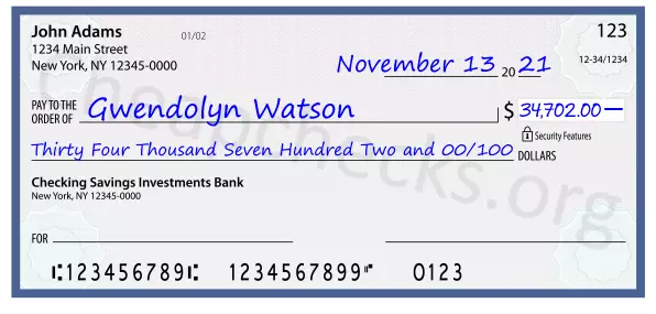 Thirty Four Thousand Seven Hundred Two and 00/100 filled out on a check