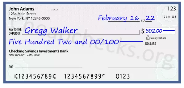 Five Hundred Two and 00/100 filled out on a check