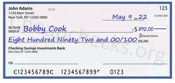 Eight Hundred Ninety Two and 00/100 filled out on a check