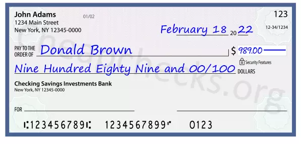 Nine Hundred Eighty Nine and 00/100 filled out on a check